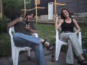 Sitting in my back yard with my friend Saisha, enjoying my lovely Xingu beer.