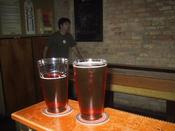 The two pints of Red beer that Adam bought for me at Herkimar. there he is in the background...throwing some crappy shot on the shuffleboard table undoubtedly.