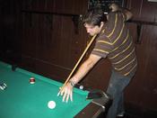 Adam shooting some pool. he actually made this shot. unbelieveable.